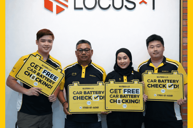 BateriHub Car Battery Health Checking Event | Locus-T | 14 June 2024 BateriHub team promoting free car battery checking at a mall booth with yellow branding, balloons, and promotional bags.