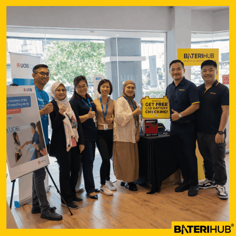 UOB Cover Pic BateriHub and UOB team members posing during a retail activation event featuring free car battery checking promotion at a Malaysia outlet.